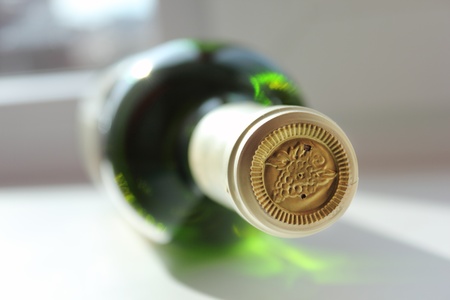 sealed bottle of white wine, close perspectiveの写真素材