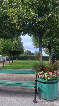 Bench in the park with flowers and trees in the background, Vienna,  Austriaの写真素材