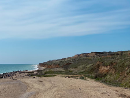 Coastline in Chornomorsk, Ukraine, with blue sky.の写真素材