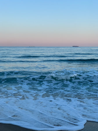 Beautiful sunset on the sea. Sea waves and the sky.の写真素材