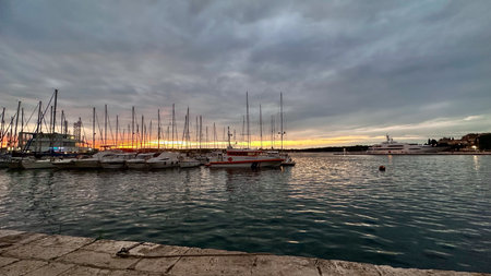Sunset in the old port of Pula, Croatiaの写真素材