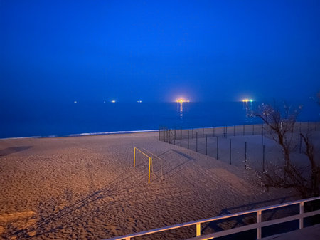 Volleyball net on the beach at night in Chornomorsk, Ukraineの写真素材