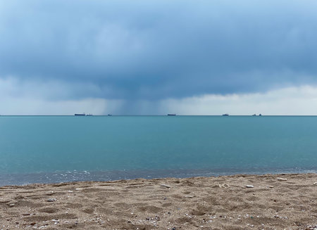 Seascape with stormy sky and cargo ships in the seaの写真素材