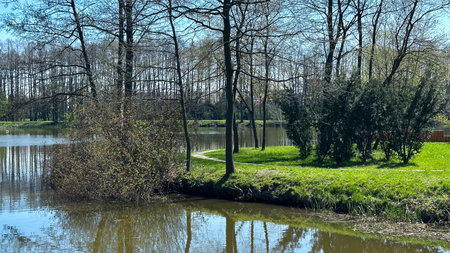Spring landscape with river and trees in the city park. Spring landscapeの写真素材