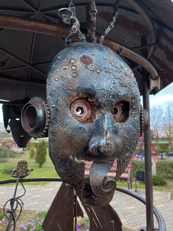 Old rusty metal head in the park, close-up of photoの写真素材