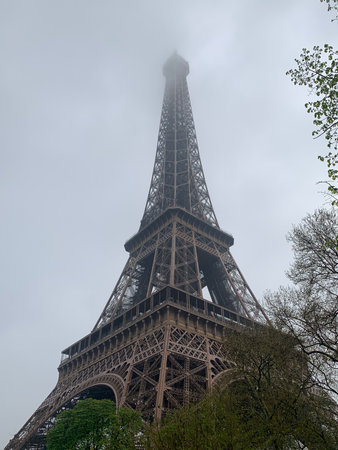 The Eiffel Tower in Paris, France on a cloudy day.の写真素材