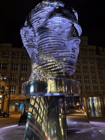 The sculpture in the center of a city at nightの写真素材