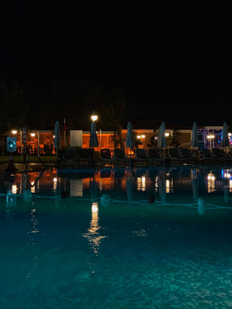 Swimming pool at night in a hotel, Turkeyの写真素材