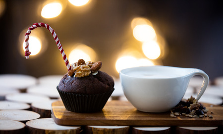 Chocolate muffin and cappuccino on wooden tableの写真素材