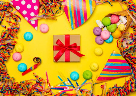 photo of  cute gift and wonderful event decorations on the beautiful yellow studio backgroundの写真素材