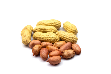 Peanut unpeeled or peeled closeup isolated on white background