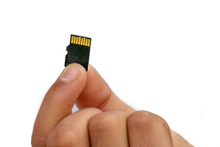 Micro SD Card holds in hand finger isolated on white background