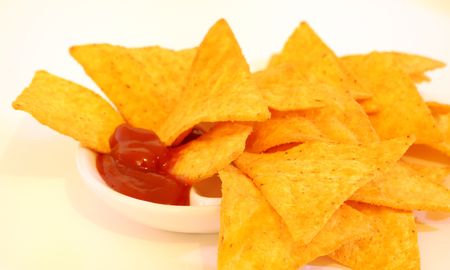 Mexican chips in tomato sauce with white backgroundの写真素材