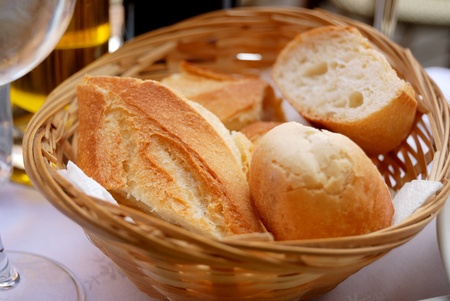 Pieces of french bread in a basket  の写真素材
