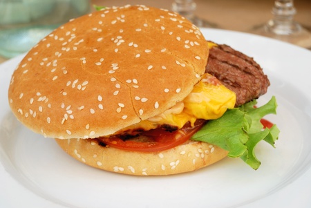 delicious isolated american cheese burger on table の写真素材