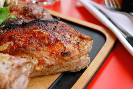 Close-up of delicious isolated pork ribbs on table の写真素材