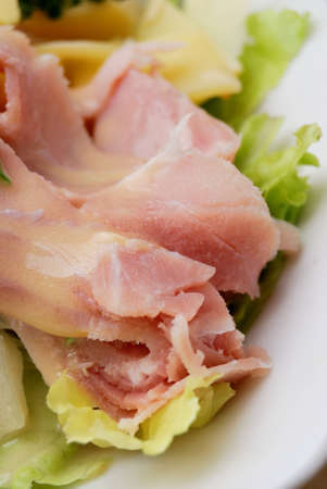 close-up of isolated fresh salad with ham, lettuce, の写真素材