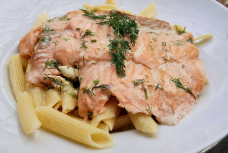 close-up of plate of pasta and fresh salmonの写真素材