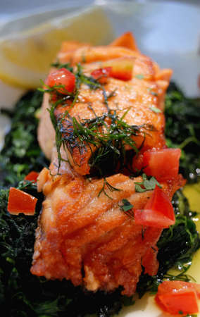 Salmon and spinach for a meal in restaurant  の写真素材