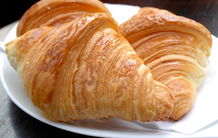 close-up of isolated croissants in white plateの写真素材