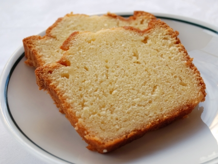 two pieces of cake in white plate 