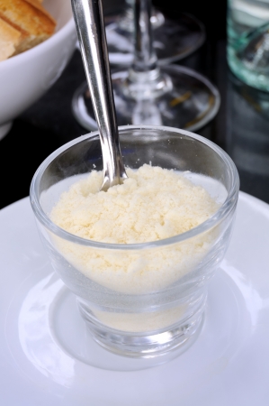 parmesan powder in a glass isolated on a table の写真素材