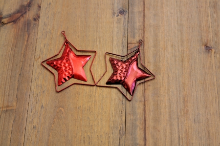 Isolated on wood two red christmas starsの写真素材