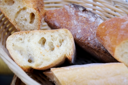 Pieces of french bread in a basket の写真素材