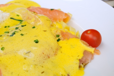 close-up of plate of penne and smoked salmon with cream sauceの写真素材