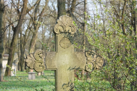 Old cross on abandoned Pokrov cemetery in Riga, Latvia