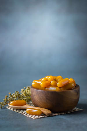 Health care vitamins on dark background