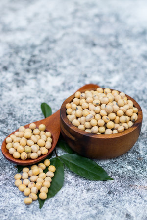 Soybean on wooden spoon. The soybean, soy bean, or soya bean is a species of legume native to East Asia.の写真素材