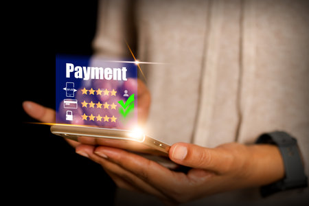 woman hand holding a smartphone connected to an application online payment online shopping and...