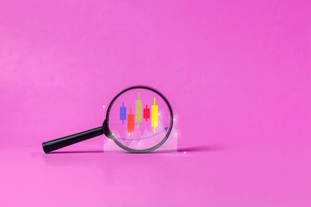 Magnifying glass to display graph icons, candlesticks, search stock information, trade stocks. financial investment, stock investing plan, stock information search concept, stock trading.の写真素材