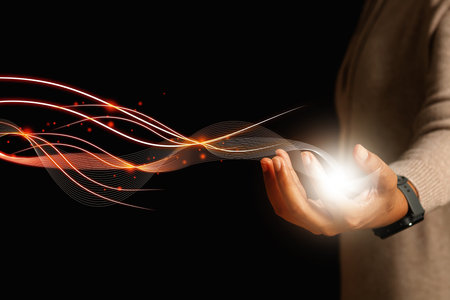 Female hand touching mobile phone with metaverse cosmic light lines. Digital transformation concept for the next generation of technology.の写真素材