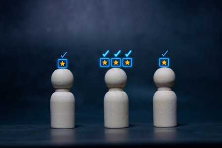 Wooden human figures with glowing check mark icons, representing choice, decision making, evaluation, and approval.の写真素材