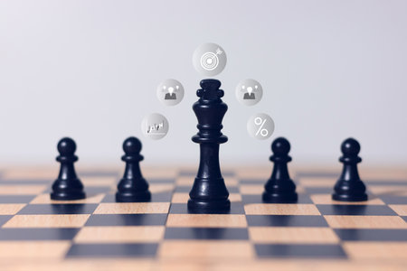 Black chess king surrounded by pawns on wooden chessboard, symbol of leadership, teamwork, business strategy, authority, and competition concept.の写真素材