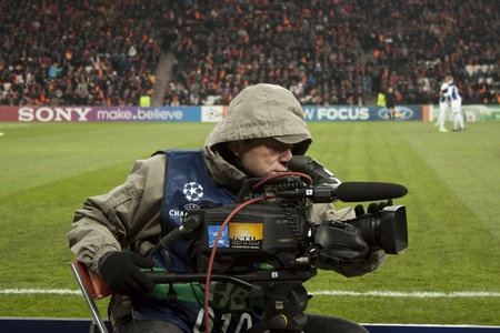 DONETSK, UKRAINE - NOVEMBER 23, 2011: Unidentified cameraman working on the match of the Champions League FC Shakhtar Donetsk vs. FC Porto in Donetsk Donbass Arena on November 23, 2011のeditorial素材
