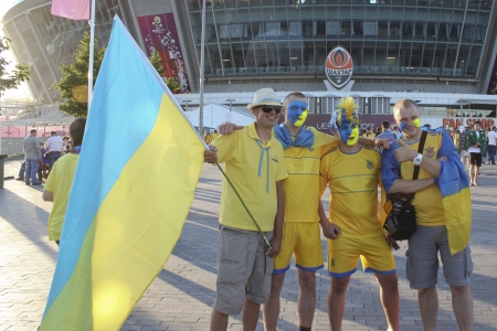 DONETSK, UKRAINE - JUNE 19, 2012: Ukrainian fans before the match EURO 2012 Ukraine vs. England in Donetsk at Donbass Arena. They do not know that they will lose their favorite team 0 - 1.のeditorial素材