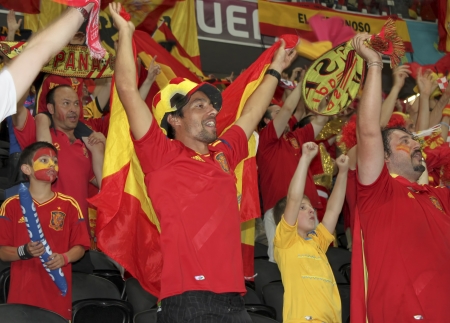 DONETSK, UKRAINE - JUNE 23, 2012: Spanish national team fans celebrate victory in quarterfinal EURO 2012 Spain vs. France. Spain won 2-0 and qualified for the semifinals, where it waiting for national team of Portugalのeditorial素材