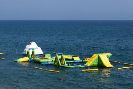 CALELLA, SPAIN - JULY 19, 2013  Small water amusement park on the beach of Calella on July 19, 2013 Favorite vacation spot of children and adultsのeditorial素材