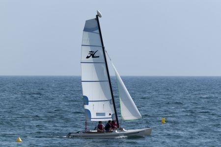 CALELLA, SPAIN - JULY 19, 2013  Catamaran sailing in the Mediterranean Sea in Calella on July 18, 2013  Every lover of sailing can ride on the Seaのeditorial素材