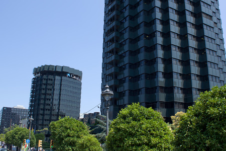 BARCELONA, SPAIN - JULY 12, 2013  The architectural ensemble of modern buildings on the one of the most visited streets of Barcelona - Parallel  Buildings owned the CaixaBank one of the most bank od Spainのeditorial素材