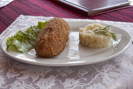 Chicken Kiev with lettuce and potato puree