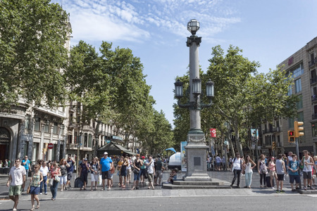 BARCELONA, SPAIN - JULY 13, 2013: Rambla - a pedestrian street in the center of Barcelona. There is always a lot of touristsのeditorial素材