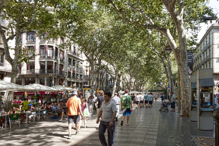 BARCELONA, SPAIN - JULY 13, 2013: Rambla - a pedestrian street in the center of Barcelona. There is always a lot of touristsのeditorial素材