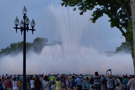 BARCELONA SPAIN  JULY 13 2013: Fountain on the Avenue Reina Maria Cristina in Barcelona in the eveningのeditorial素材