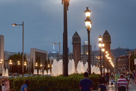 BARCELONA SPAIN  JULY 13 2013: Avenue Reina Maria Cristina in Barcelona in the eveningのeditorial素材