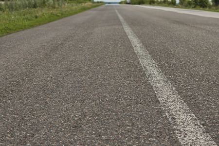 The asphalt road with white continuous strip. No carの写真素材