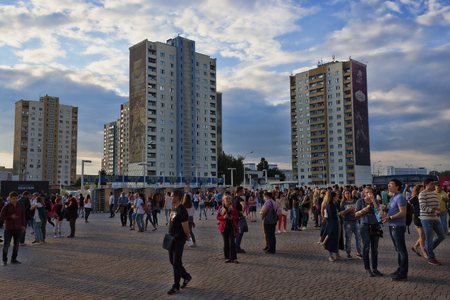 KHARKIV, UKRAINE â JUNE 6, 2016: People in the square at the Metallist stadium in Kharkov and on the background of newly-built housesのeditorial素材